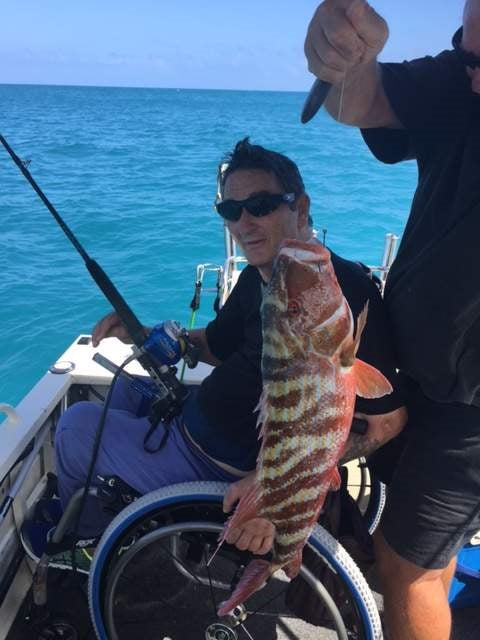 Hands-on Adjustable, Hinged Fish Fighting Rod Holder for Wheelchair Seat - Inclusive Inc