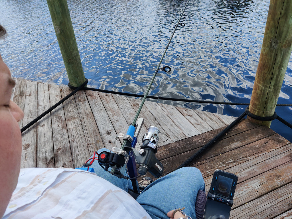 Hands-on Adjustable, Hinged Fish Fighting Rod Holder for Wheelchair Seat -  Marks perspective in wheelchair on dock,  Rod handle cut