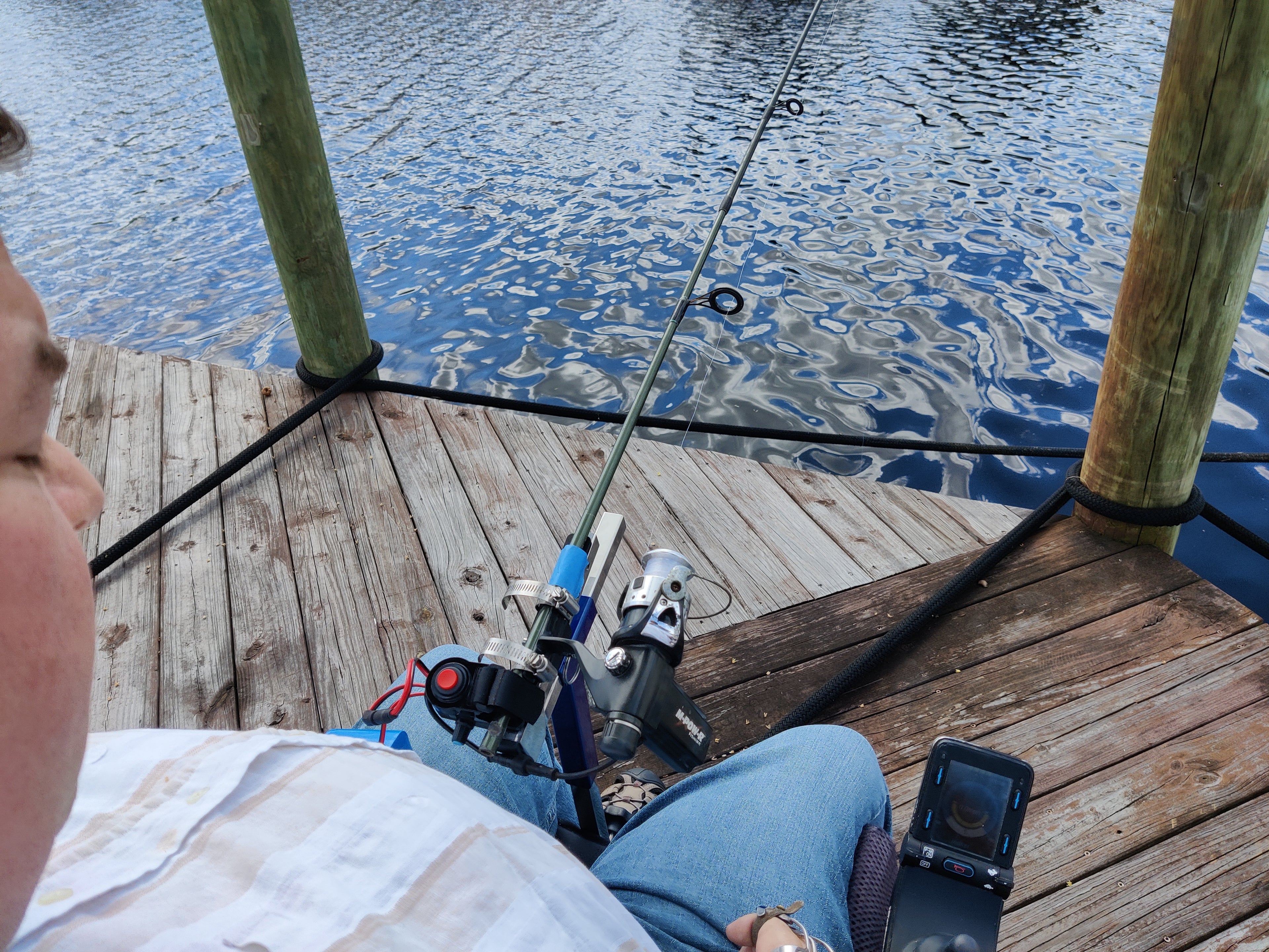 Hands-on Adjustable, Hinged Fish Fighting Rod Holder for Wheelchair Seat -  Marks perspective in wheelchair on dock,  Rod handle cut