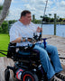 Hands-on Adjustable, Hinged Fish Fighting Rod Holder for Wheelchair Seat -  Mark in wheelchair on dock closeup