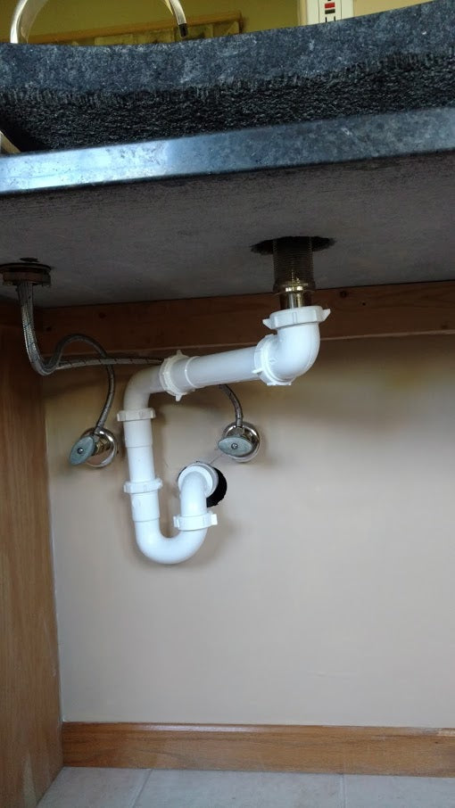 Plumbing Trap at the Wall under bathroom sink for Wheelchair Accessibility